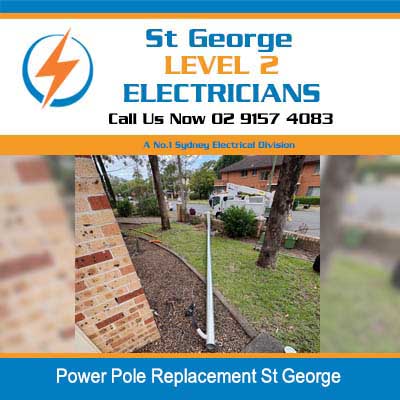 New metal power pole ready for installation next to a residential brick wall in St George